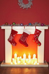 Christmas stockings hanging over fireplace