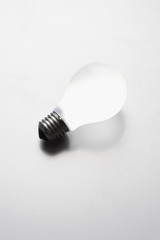 Light bulb over colored background