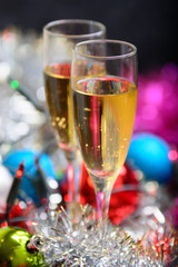 Cristmas glasses with champagne on cristmas decoration background