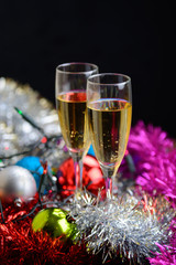 Cristmas glasses with champagne on cristmas decoration background