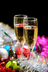 Cristmas glasses with champagne on cristmas decoration background
