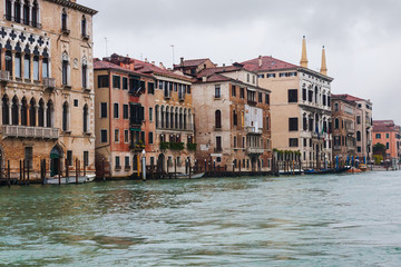 Fototapeta na wymiar wet palaces on Grand Canal in Venice in rain