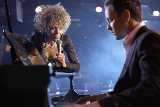 Female Jazz Singer And Pianist On Stage