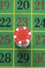 High angle view of gambling chips on roulette table