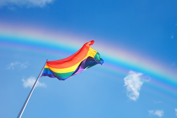 Rainbow Flag on the blue sky background