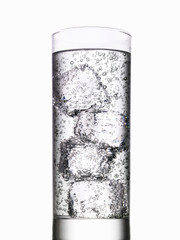 Glass of water with ice cubes on white background