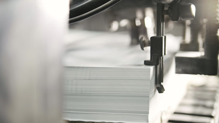 Printed sheets of paper are served in the printing press. Offset , CMYK - obrazy, fototapety, plakaty