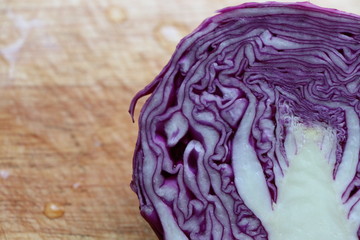 Closed up purple cabbage fresh vegetable for good health on the wood block 