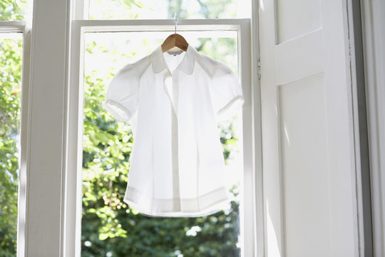 Blouse On Hanger At Domestic Window