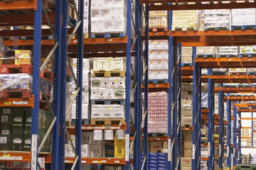 View of shelves in warehouse full of merchandise