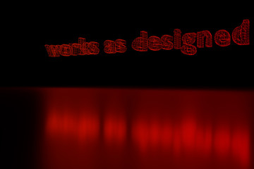 Die englischen Worte "works as designed" als rot leuchtendes Drahtmodell über glänzender Fläche