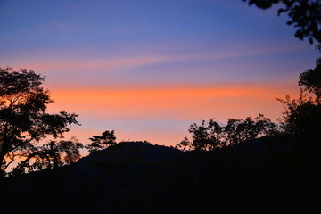 Fototapeta na wymiar last sunlight, sunset behind mountain