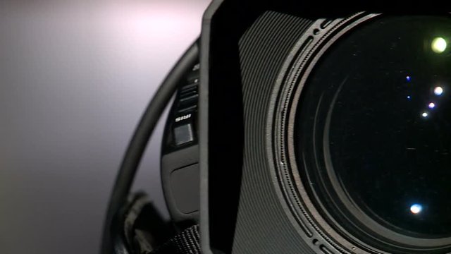 Rotate camera close-up view from the side of the lens
