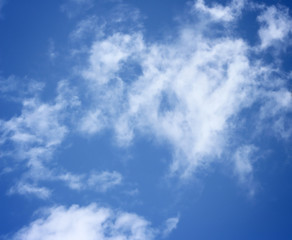 blue sky with white fluffy clouds