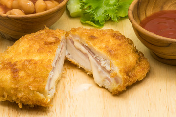 Closeup of delicious chicken cordon bleu with vegetables
