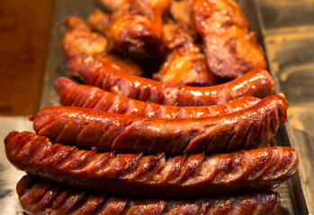 Many fried sausages in pan