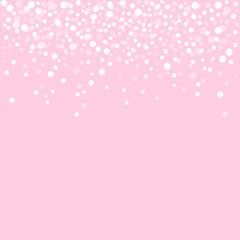 Falling snow on a light pink background. Winter background
