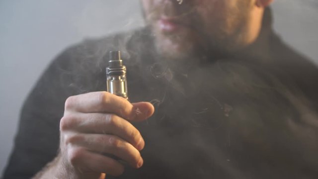 male vaper smokes vaping closeup