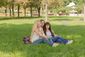 beautiful young girls in the park make selfi