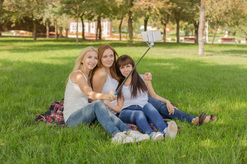beautiful young girls in the park make selfi