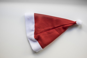Red Christmas hat close up on a white background