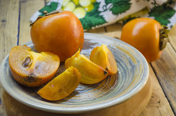 ripe persimmon on a plate