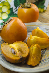 ripe persimmon on a plate