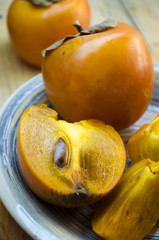 ripe persimmon on a plate