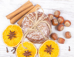 Gingerbread cookies, cinnamon and orange slices. Christmas decoration.