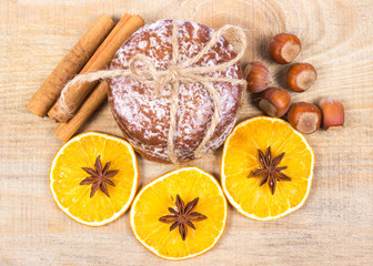 Gingerbread cookies, cinnamon and orange slices. Christmas decoration.