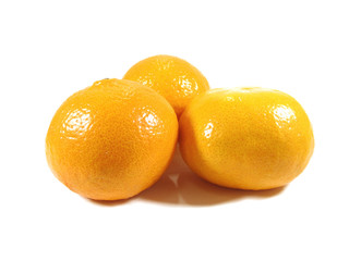 Closed up three ripe vibrant color oranges isolated on white background 