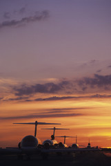 Planes Sitting on Tarmac at Sunset
