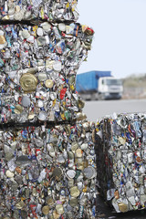 Stakes of crushed tin cans for recycling