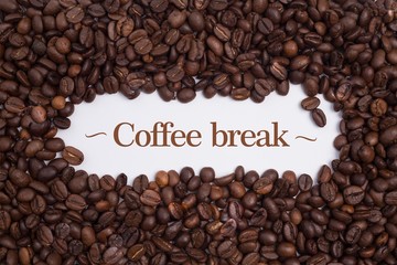 Background made of coffee beans with message 