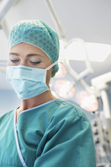 Closeup of a female doctor ready for surgery in the operating theatre 