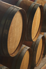 Closeup of wine casks in cellar