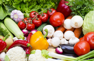 Background of fresh vegetables and greens closeup