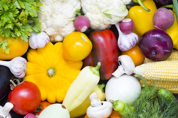 Background of fresh vegetables and greens closeup