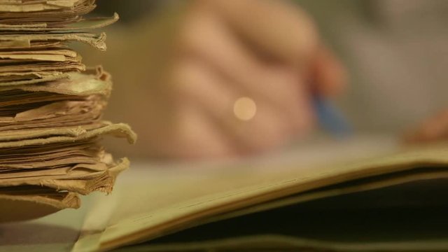 Man looking documents in the archive.