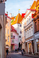 Fototapeta na wymiar Street view with gate tower in the old town of Tallinn, Estonia