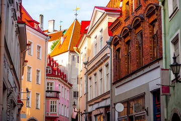 Street view with gate tower in the old town of Tallinn, Estonia - obrazy, fototapety, plakaty