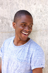 Obraz premium cool young guy smiling and looking behind