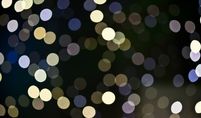 Christmas festive abstract holidays background with bokeh defocused lights and stars