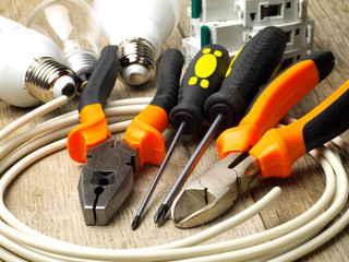 set of electrician tools, equipment and a coil of wire