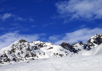 Fototapeta na wymiar Off-pistei slope at sun winter day