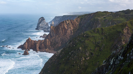 Fototapeta na wymiar Cliffs of Cape Roca (Cabo da Roca).The westernmost point of continental Europe. Sintra, Portugal.