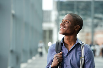 smiling black businessman with bag