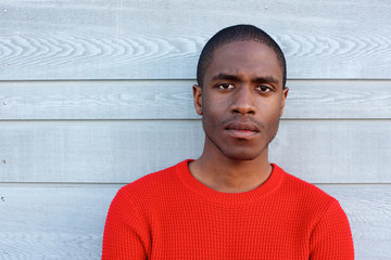 Obraz premium Close up serious black guy in red sweater