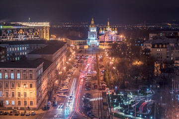 Kiev, Ukraine: aerial night view of the old town and St Michael's Golden-Domed Monastery and Cathedral 
