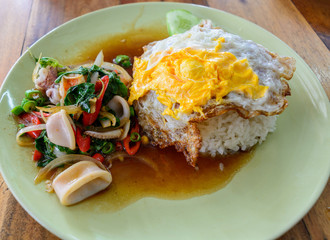 Thai food,Spicy stir fried squid with basil leave and cooked ric